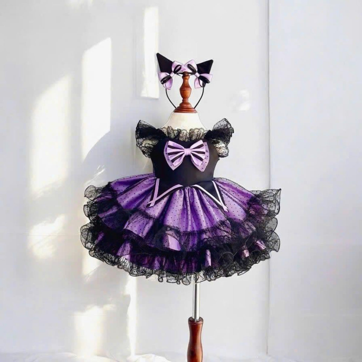 Purple and black girls Halloween dress with layered tutu, lace sleeves and bow
